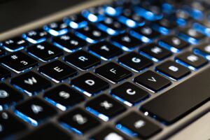 Laptop keyboard with an email icon